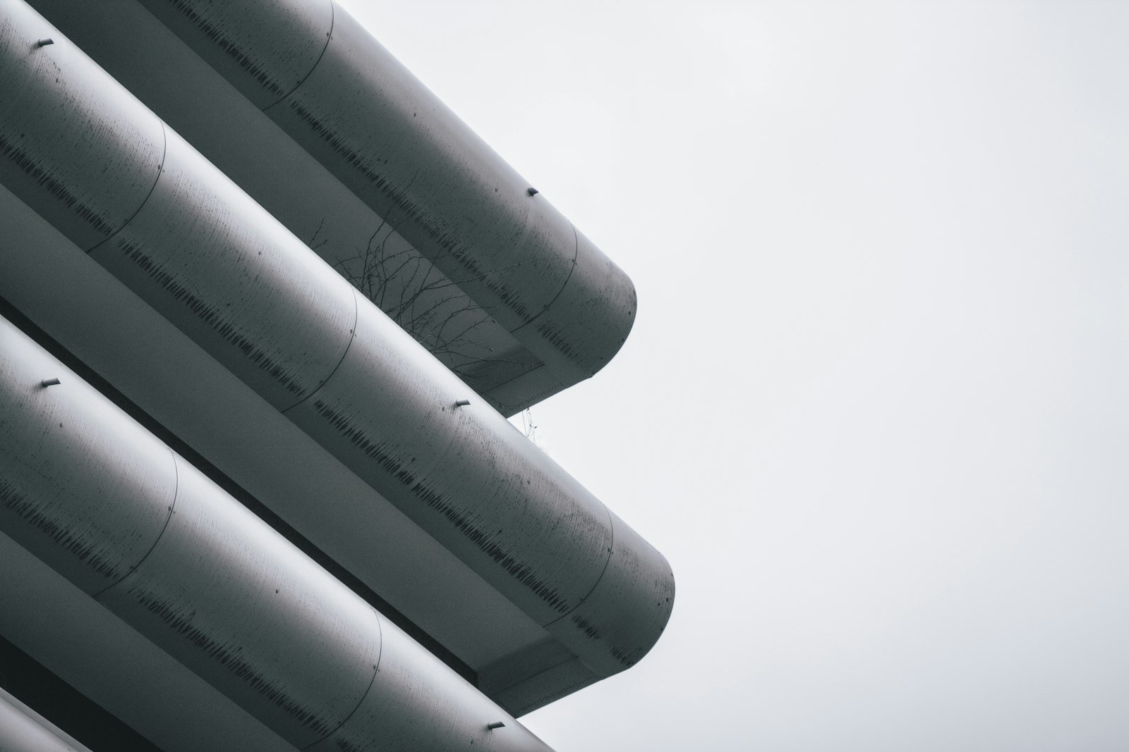 Insulated pipes against the sky