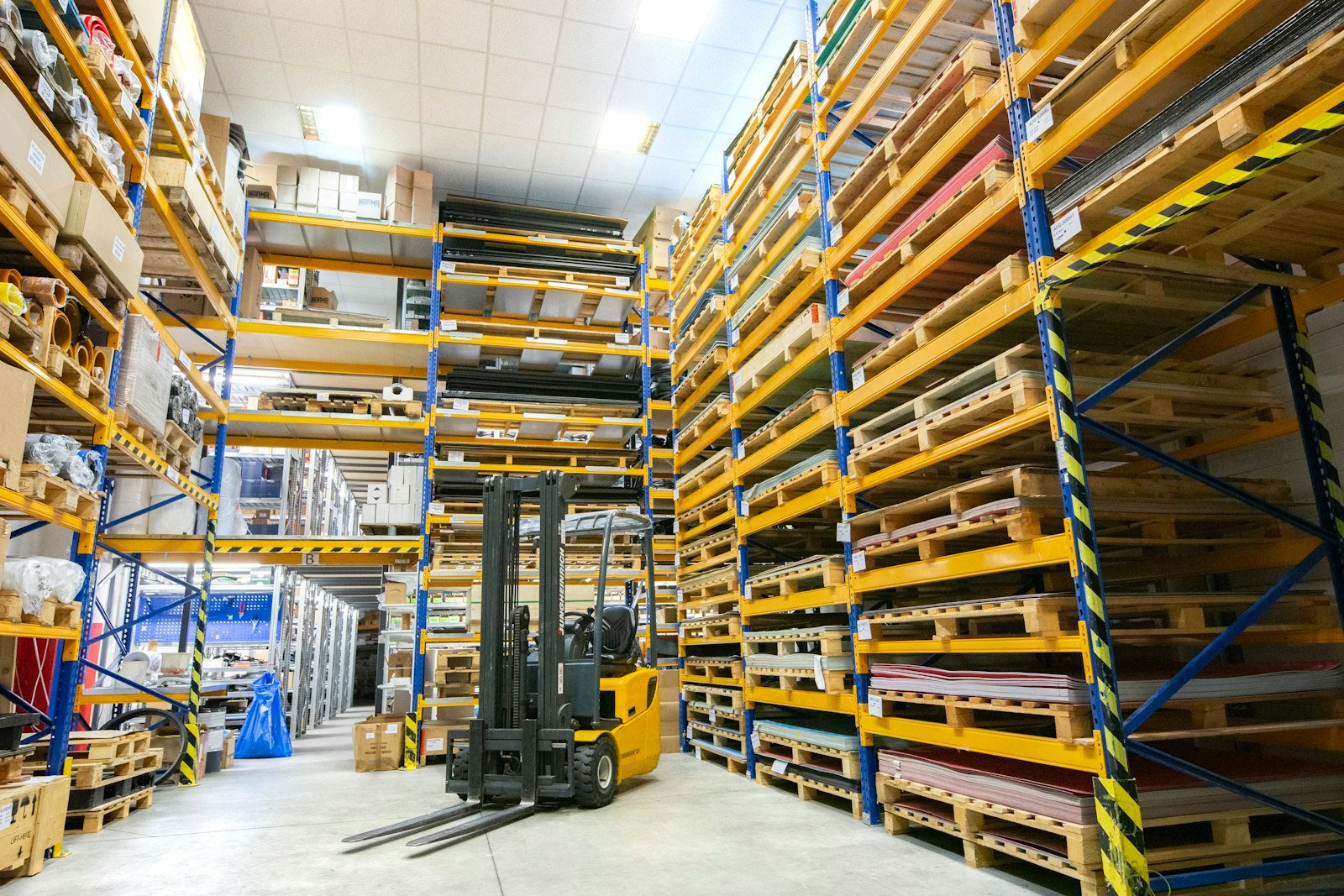 Warehouse racking with a forklift
